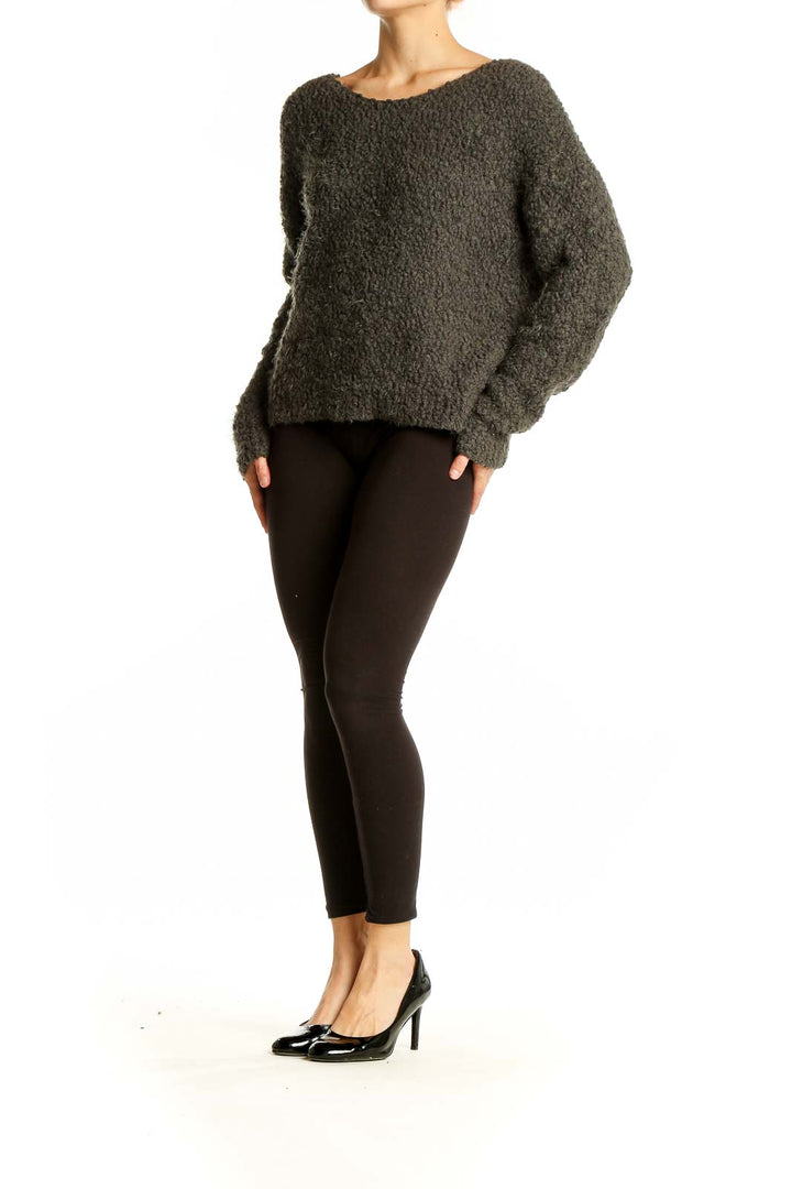 Front view of olive textured knit sweater from Sage, showcasing oversized fit and boat neckline