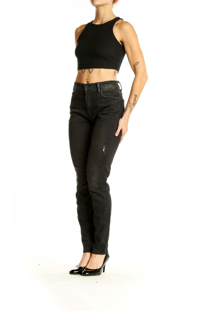 Front view of Mother black distressed straight leg jeans on model