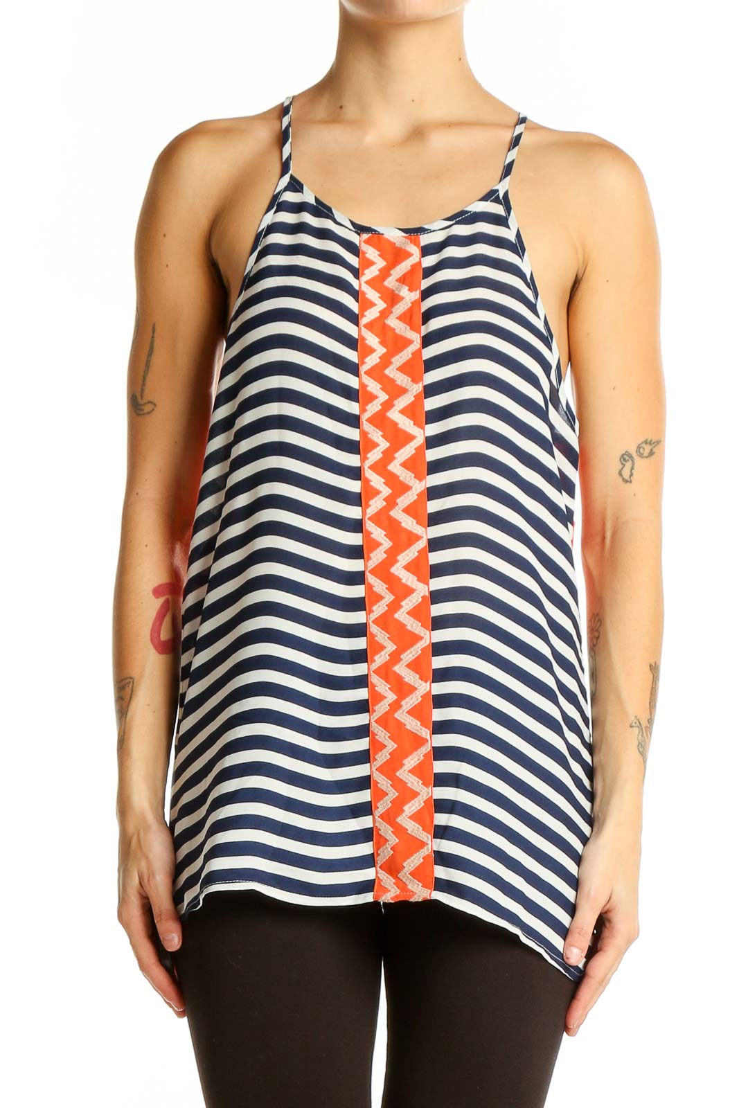 Front view of THML navy and white striped sleeveless top with orange zigzag accent