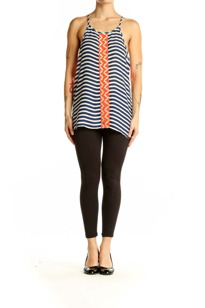 Front view of THML navy and white striped sleeveless top with orange zigzag accent