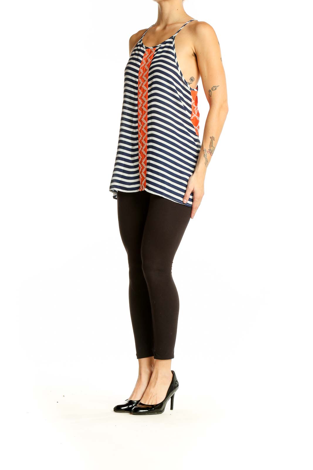 Front view of THML navy and white striped sleeveless top with orange zigzag accent