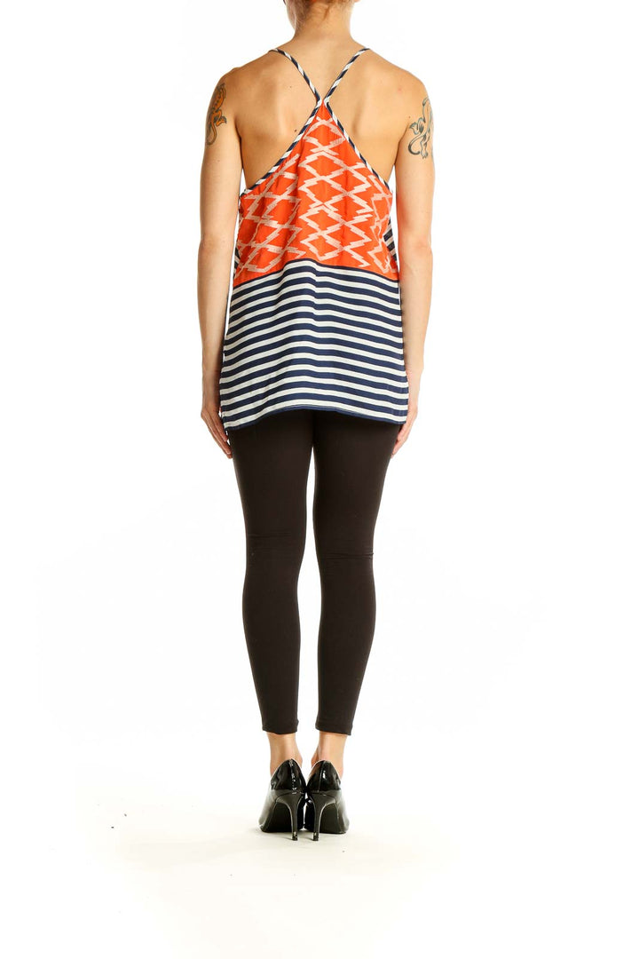 Side view of THML navy striped sleeveless top showing orange zigzag pattern