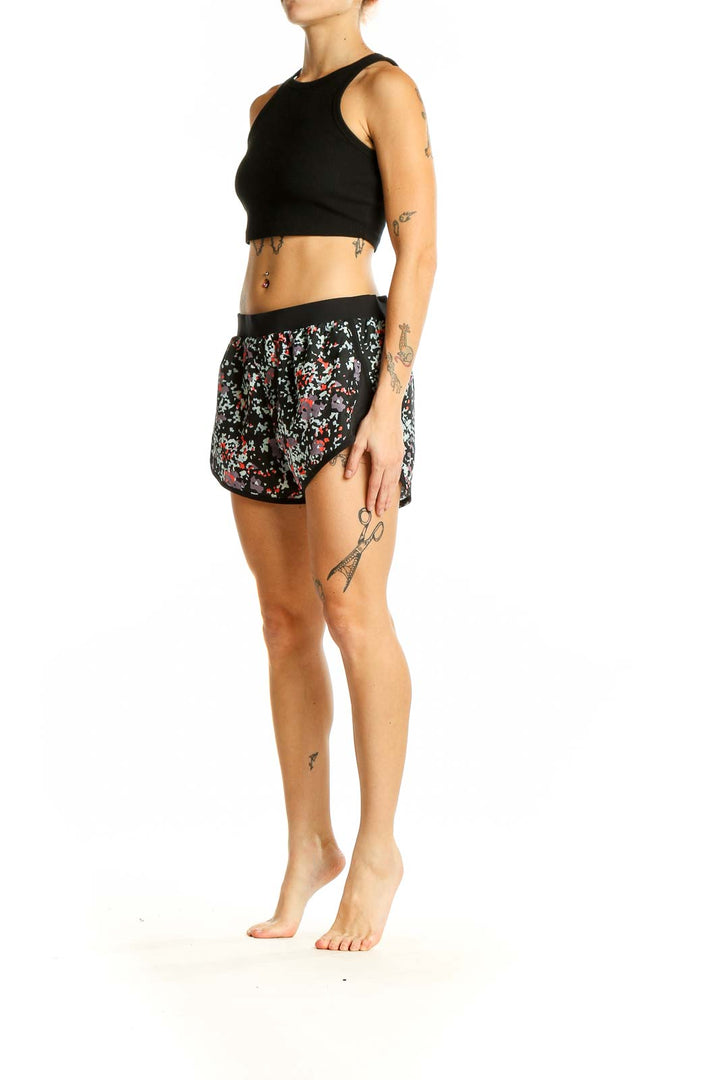 Front view of Under Armour black floral print athletic shorts