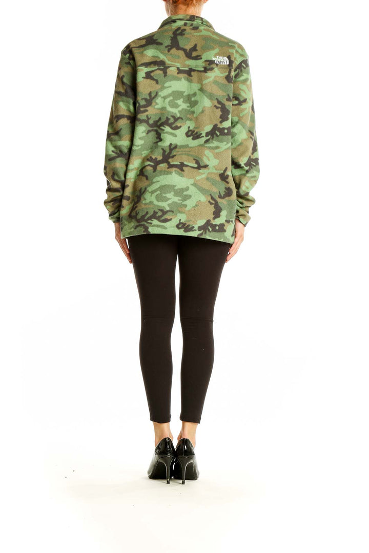 Back view of The North Face green camouflage fleece jacket on model