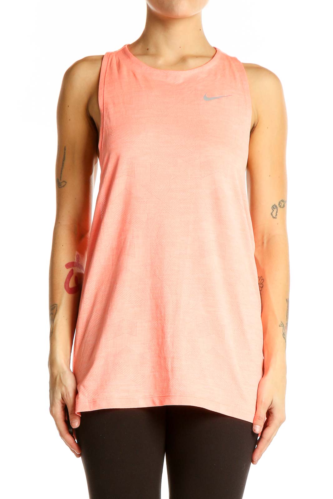 Front view of coral Nike performance tank top on model