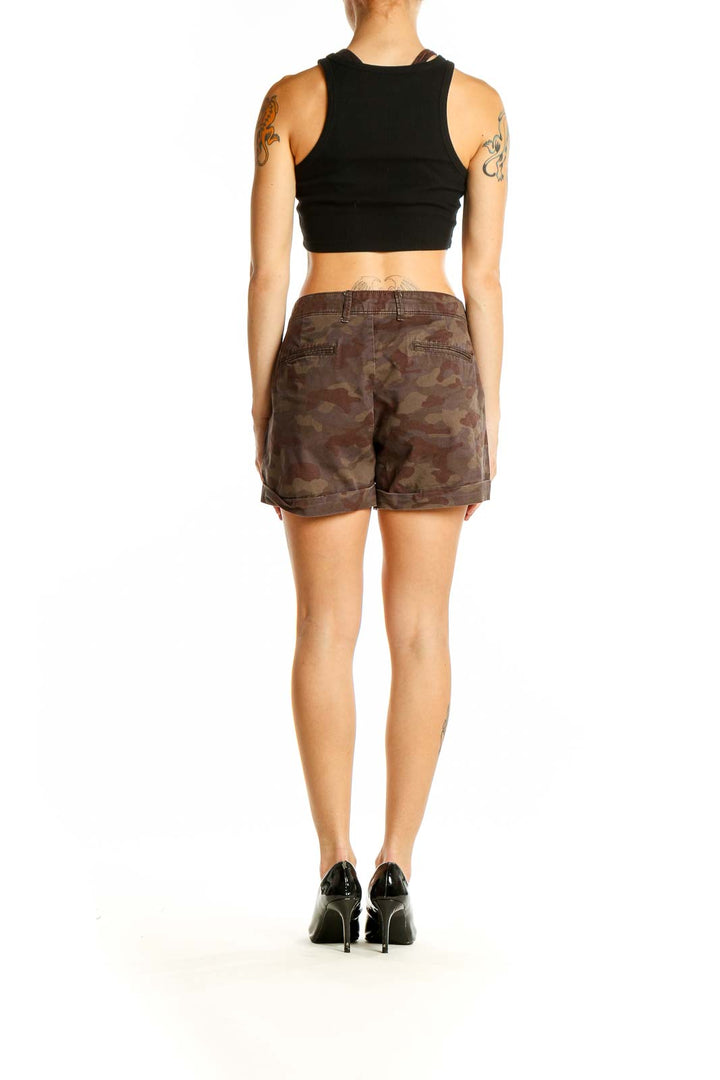 Side view of Gap brown camouflage shorts on model with black top