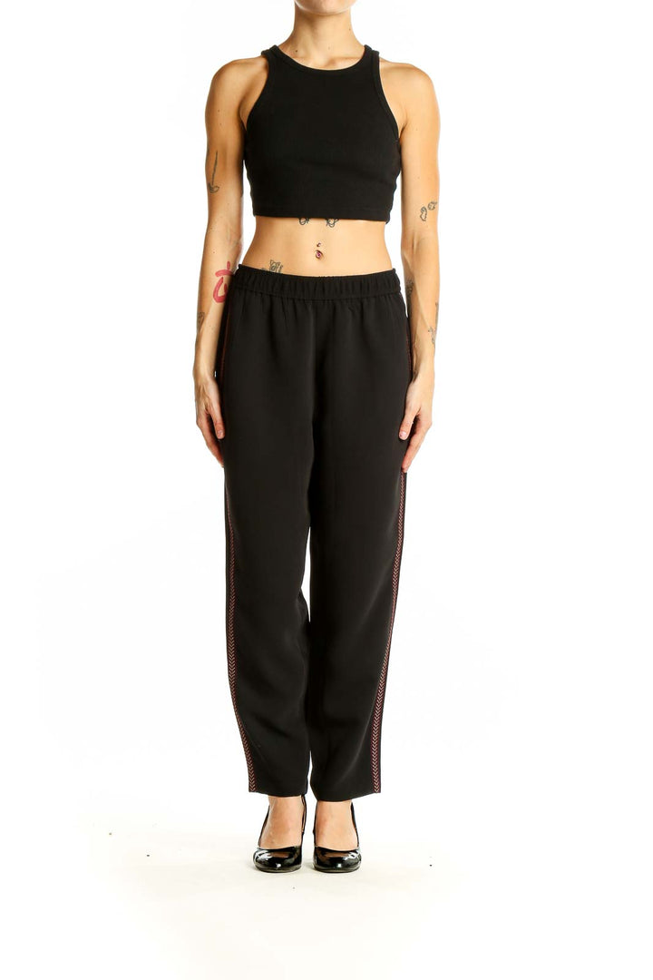 Front view of Madewell black polyester pants with side stripe