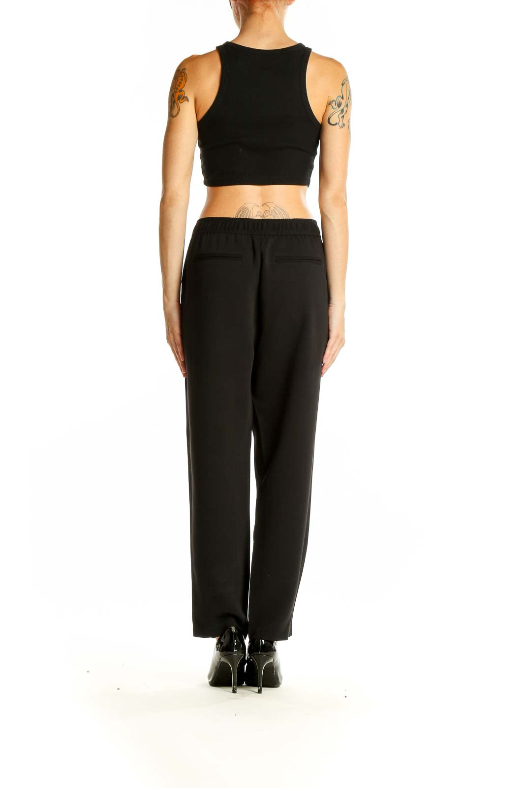 Back view of Madewell black polyester pants with side stripe