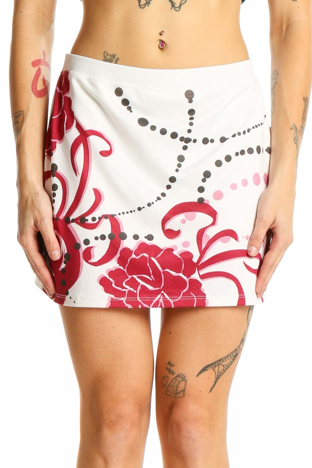 Front view of white Athleta skirt with red floral print