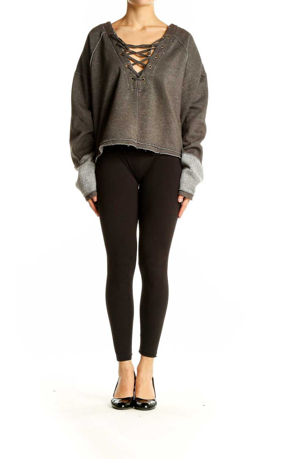 Front view of WE THE FREE gray cropped sweatshirt with lace-up V-neck