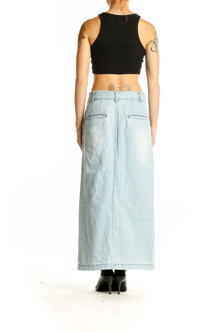 Side view of light blue denim maxi skirt showing high waist and length