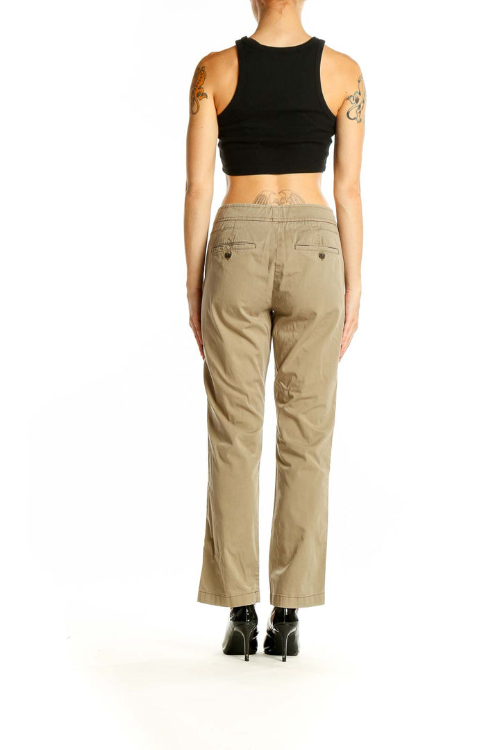 Side view of Vince khaki straight-leg pants on model