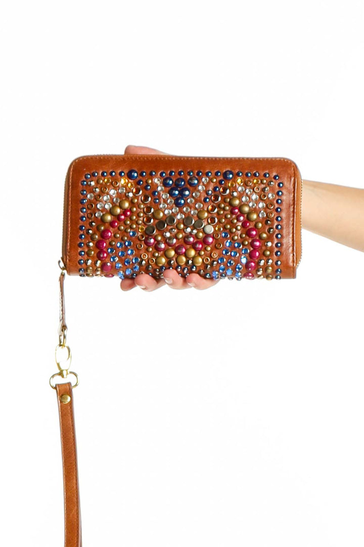 Front view of SilkRoll brown leather clutch wallet with colorful studded design