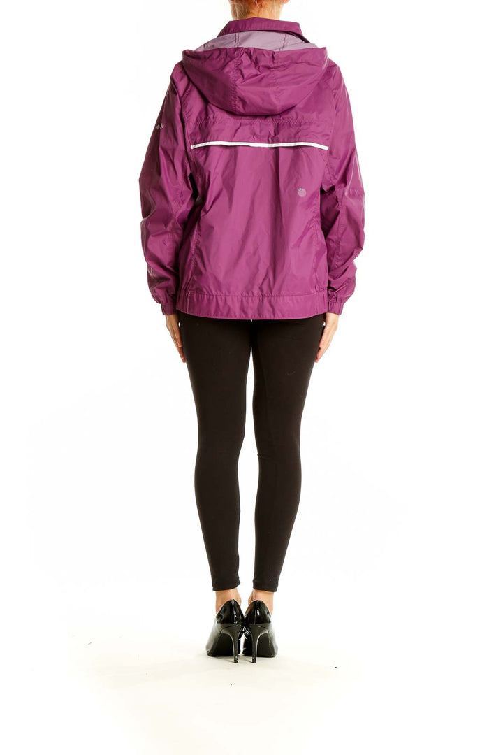 Side view of woman wearing purple Columbia activewear jacket