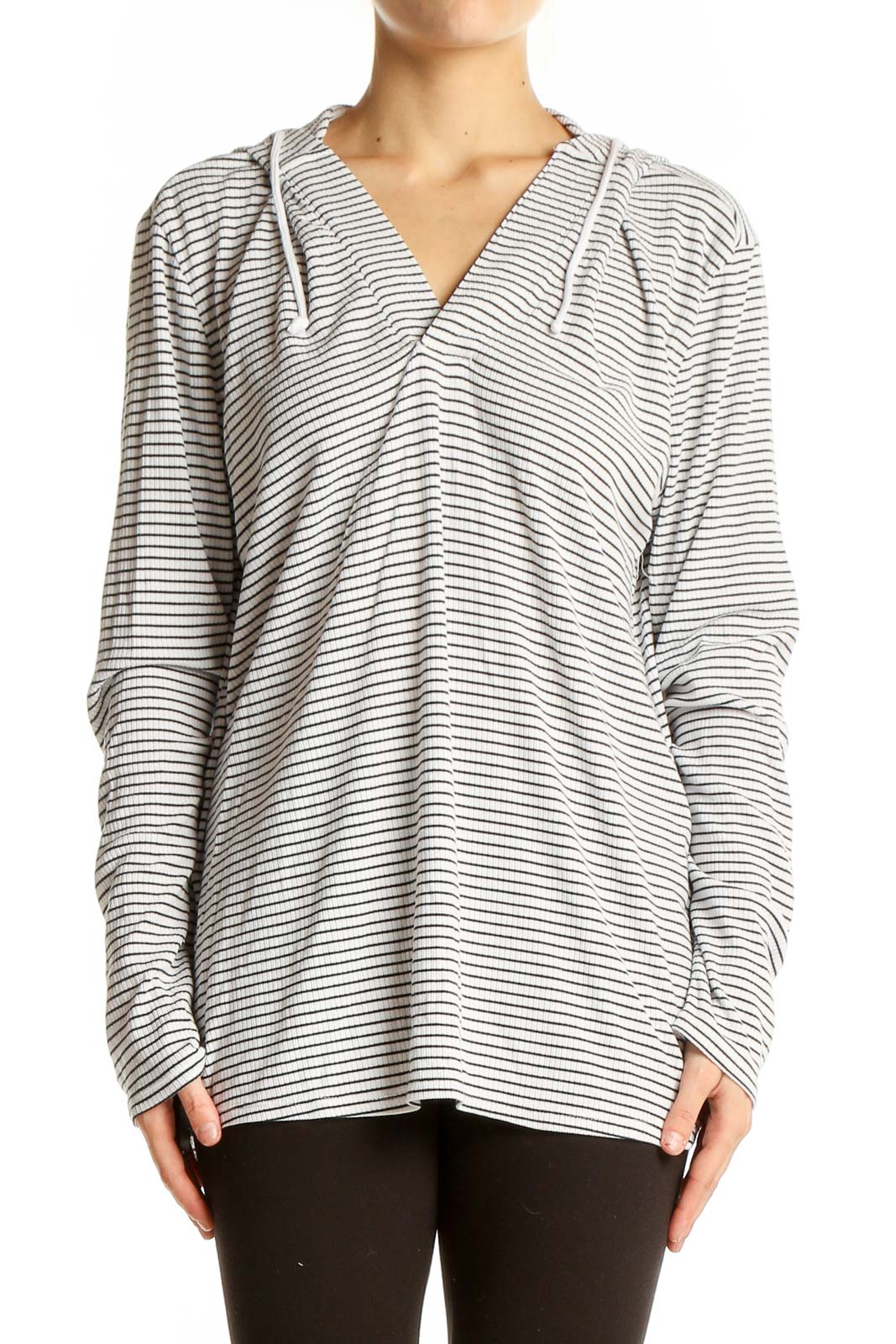 Front view of white and gray striped hooded knit top by Carve Designs