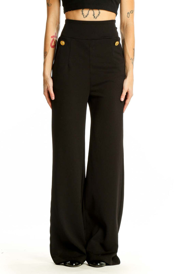 Front view of black wide-leg dress pants with gold-tone buttons