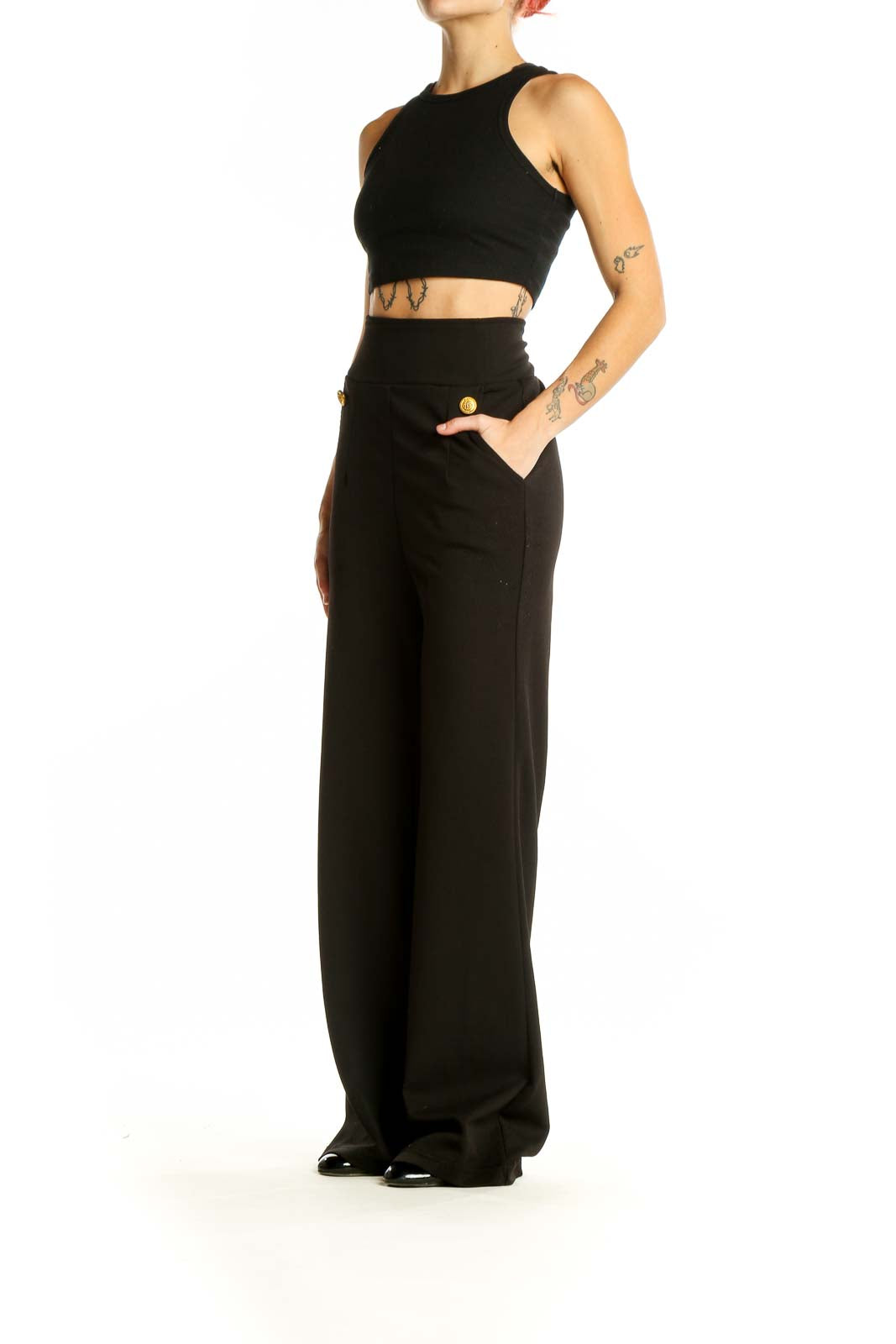 Front view of black wide-leg dress pants with gold-tone buttons