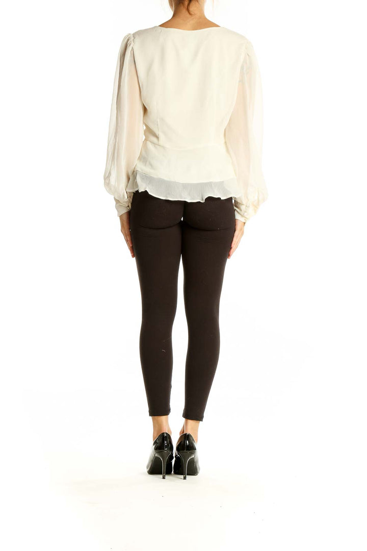 Back view of Nine West ivory sheer blouse showing flowy silhouette