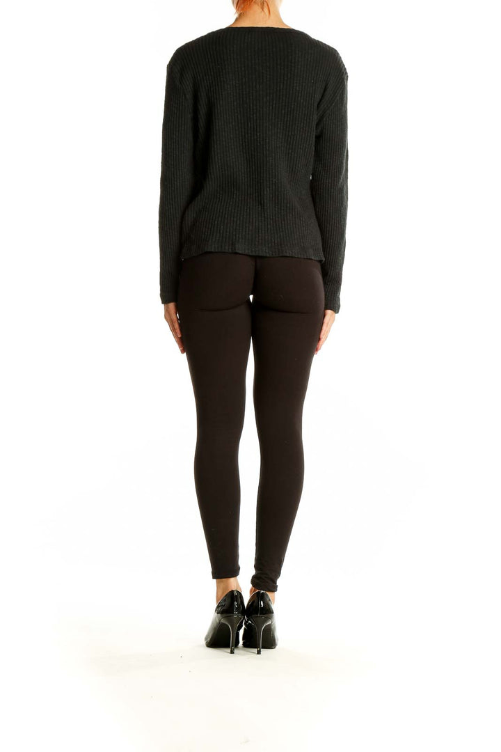 Back view of J.Crew black ribbed cotton blend sweater on model