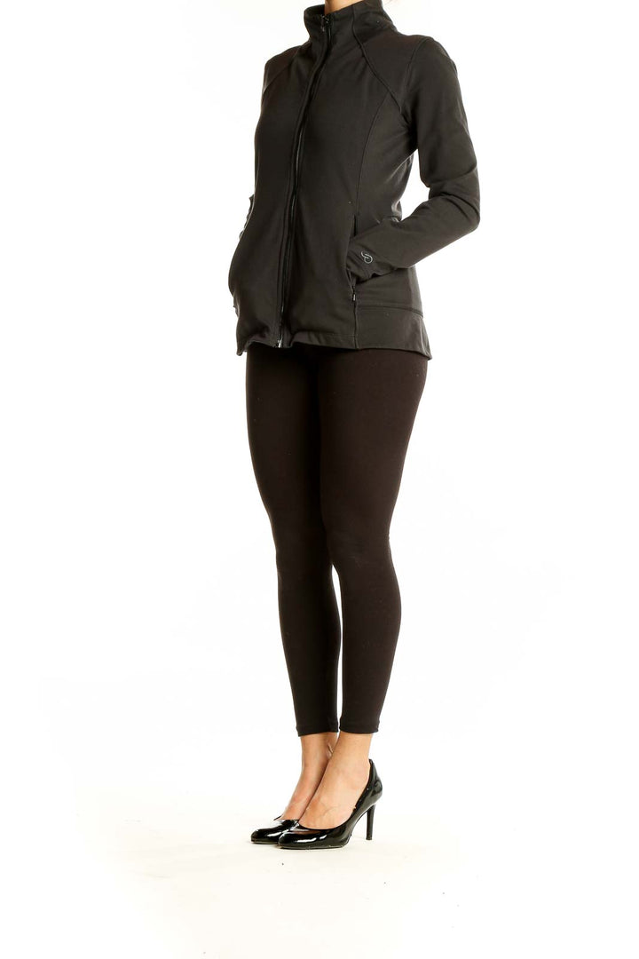 Front view of black Calia performance zip-up jacket