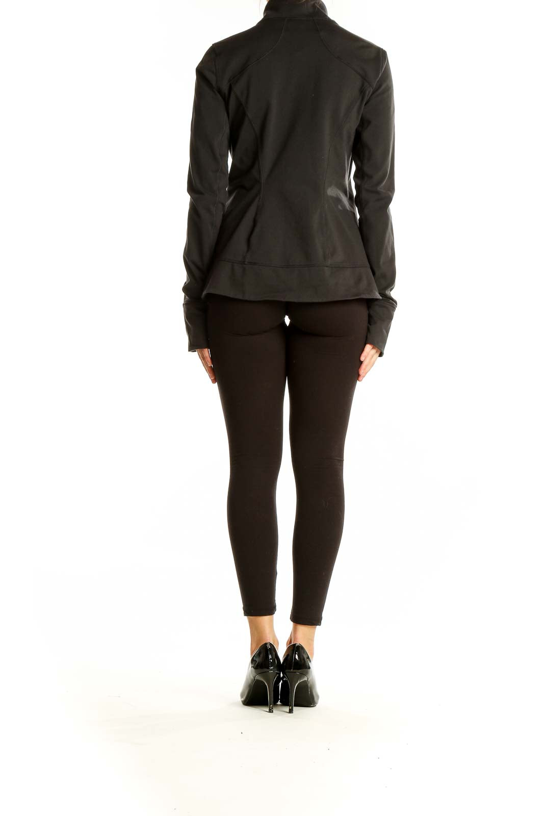 Side view of black Calia performance zip-up jacket on model