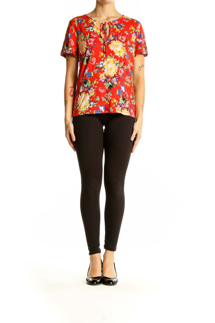 Front view of Maeve red floral short-sleeve blouse with tie neckline