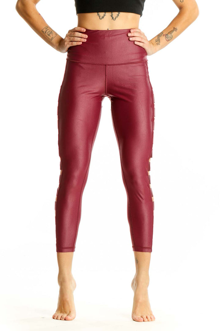 Front view of burgundy Victoria Sport high-waisted leggings with side cutouts