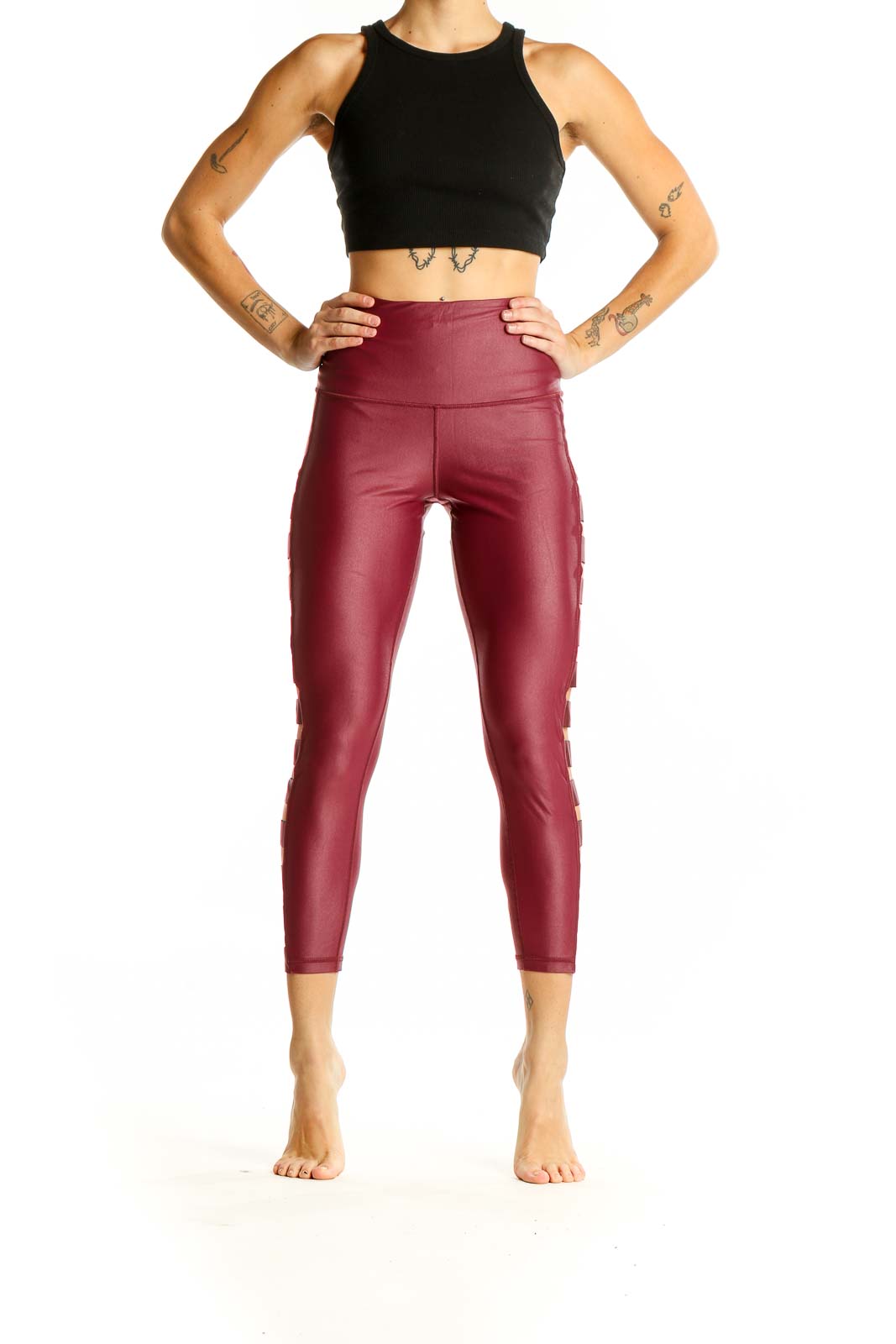 Front view of burgundy Victoria Sport high-waisted leggings with side cutouts