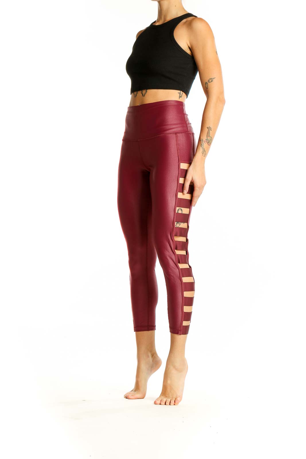 Front view of burgundy Victoria Sport high-waisted leggings with side cutouts