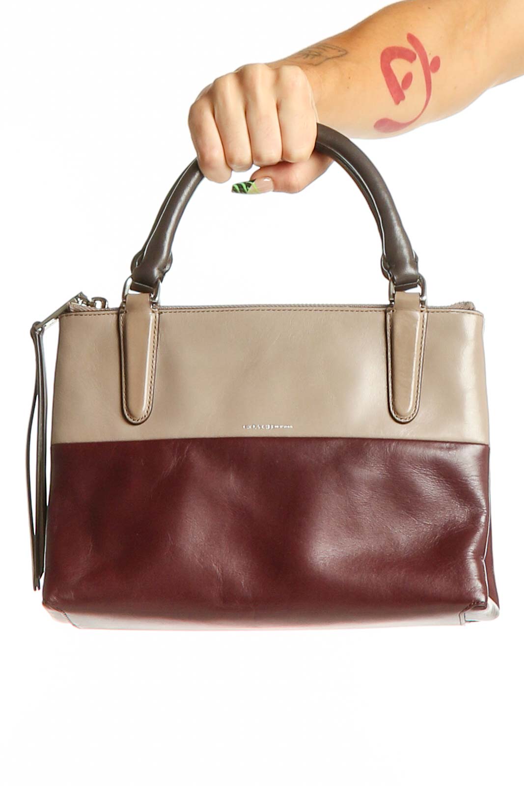 Front view of Coach two-tone leather satchel in tan and burgundy