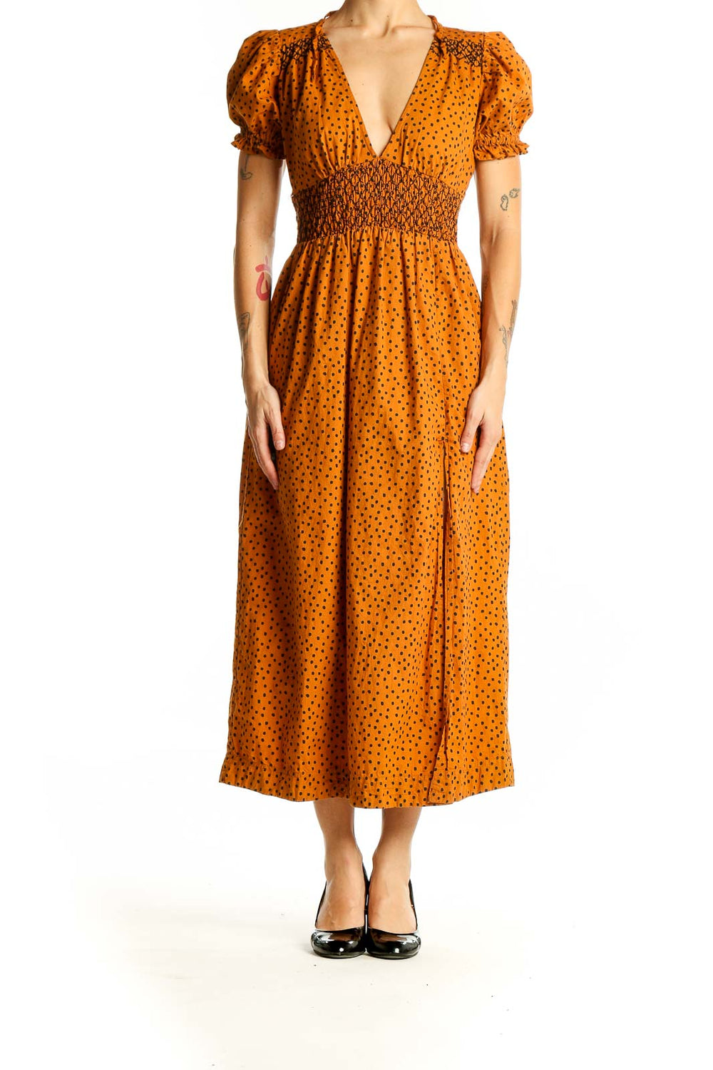 Front view of Urban Outfitters orange polka dot midi dress with puff sleeves