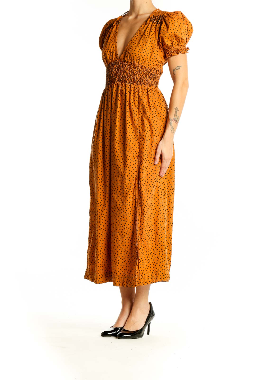 Front view of Urban Outfitters orange polka dot midi dress with puff sleeves