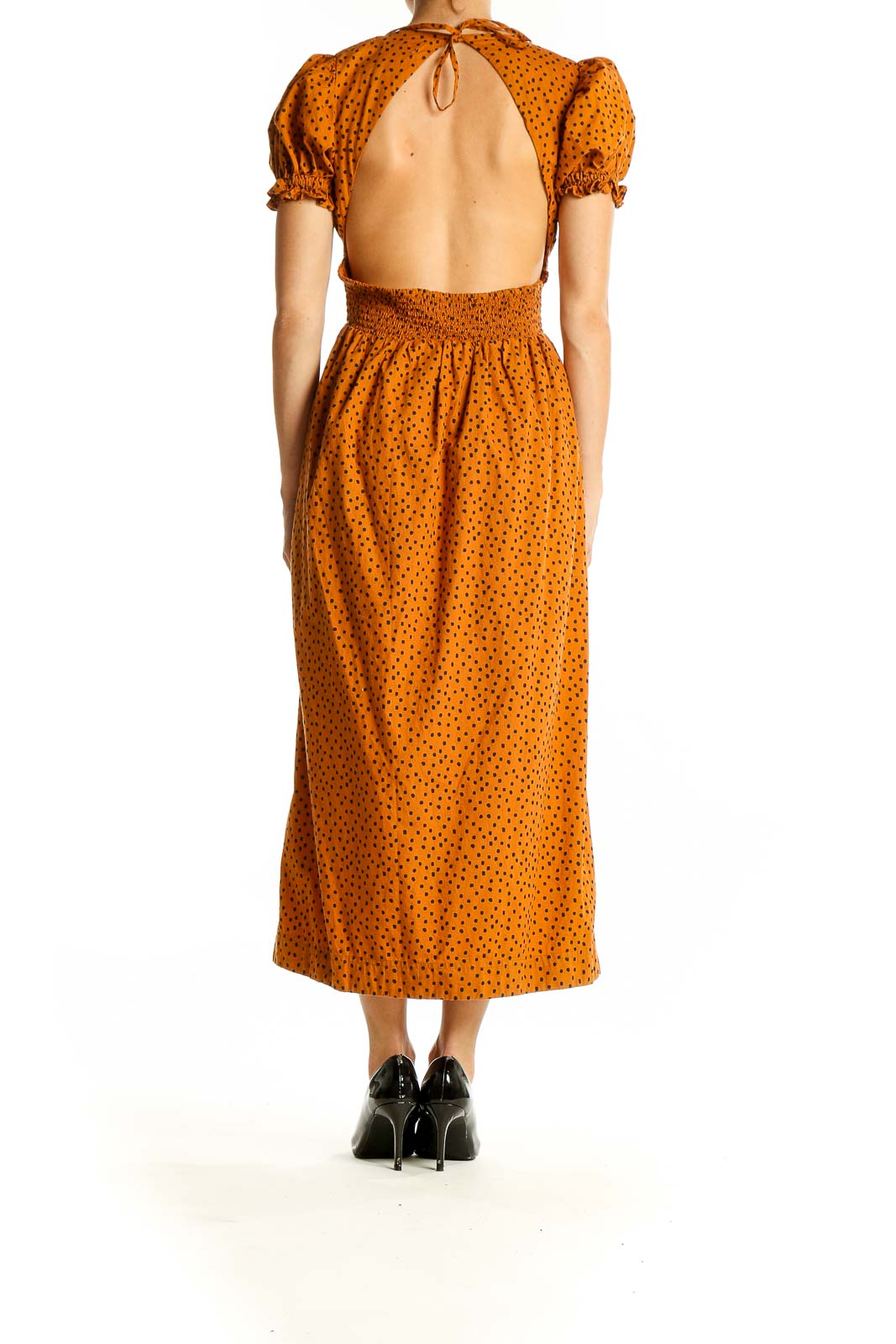 Back view of Urban Outfitters orange polka dot midi dress showing full length