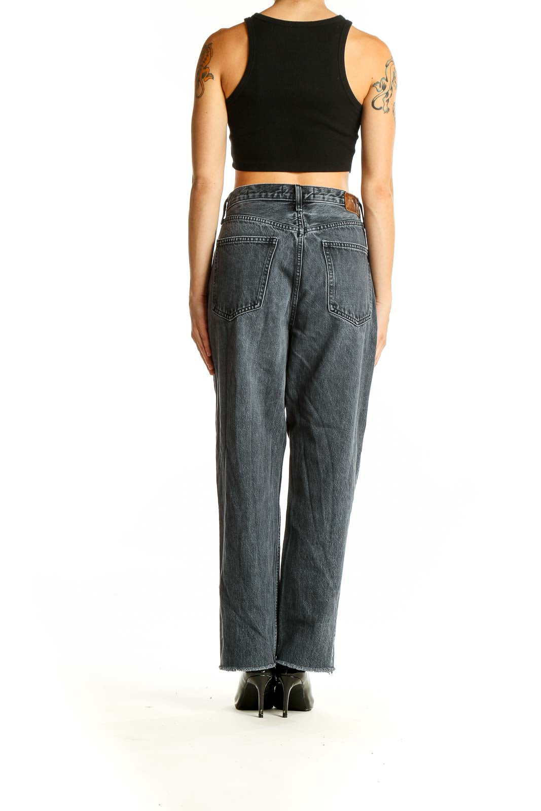 Back view of Denim Forum charcoal gray high-waisted wide-leg jeans on model