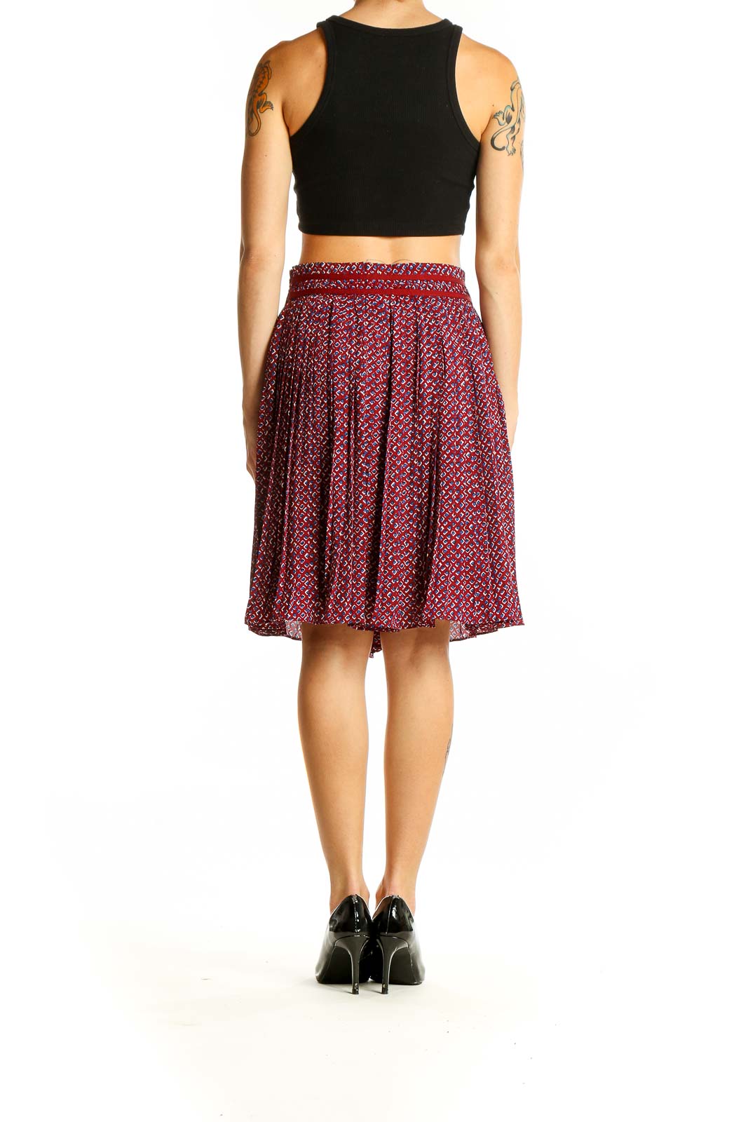 Side view of Banana Republic red patterned pleated midi skirt on model