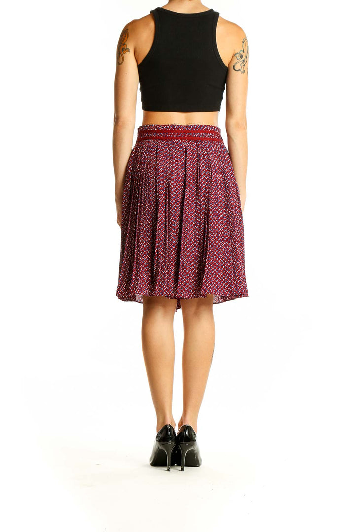 Side view of Banana Republic red patterned pleated midi skirt on model