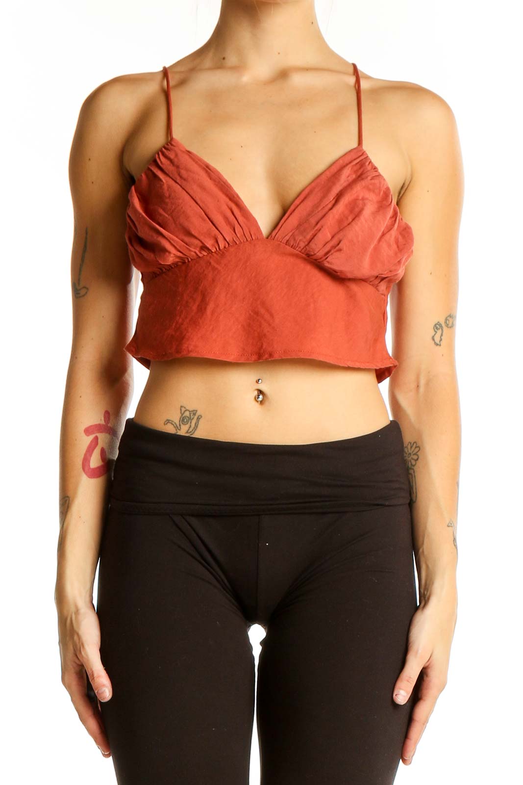 Front view of rust-colored cropped cami top with gathered bust