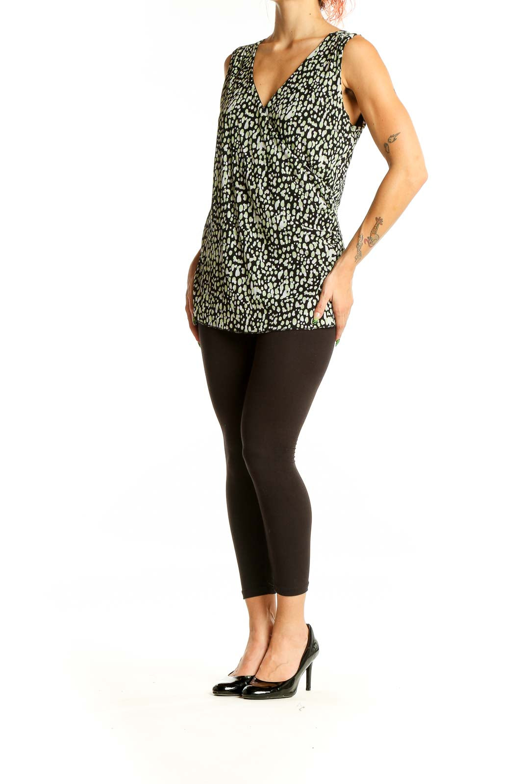 Front view of Nine & Co. black and green leopard print sleeveless top with V-neckline