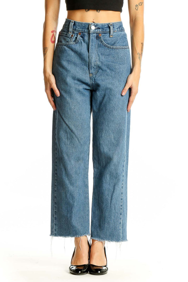 Front view of Levi's blue wide-leg jeans with frayed hem