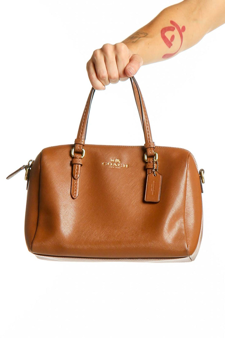 Front view of brown leather Coach satchel handbag