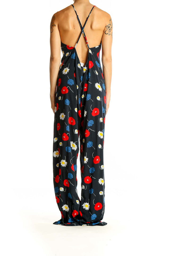 Back view of American Apparel Black Floral Print Jumpsuit showing cross-back design