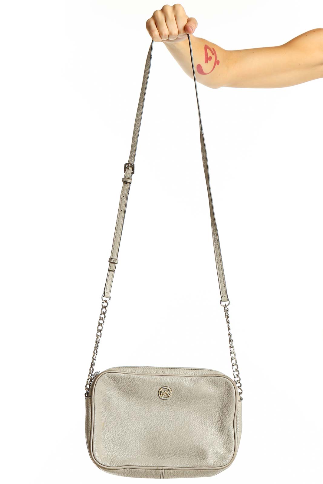 Front view of Michael Kors beige leather crossbody bag with chain strap