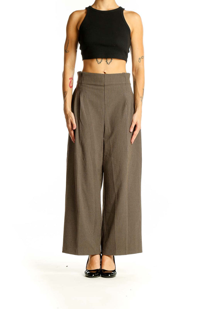 Front view of Zara brown houndstooth wide-leg trousers with high waist and pleated front