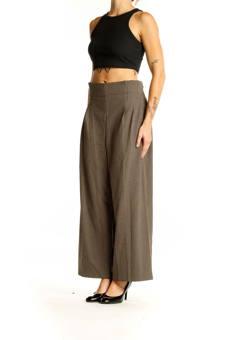 Front view of Zara brown houndstooth wide-leg trousers with high waist and pleated front