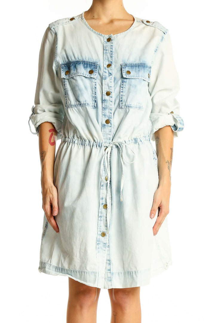 Front view of Michael Kors light blue denim shirt dress with button-up front and chest pockets