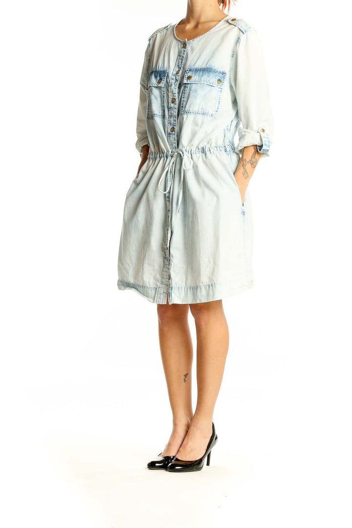 Front view of Michael Kors light blue denim shirt dress with button-up front and chest pockets