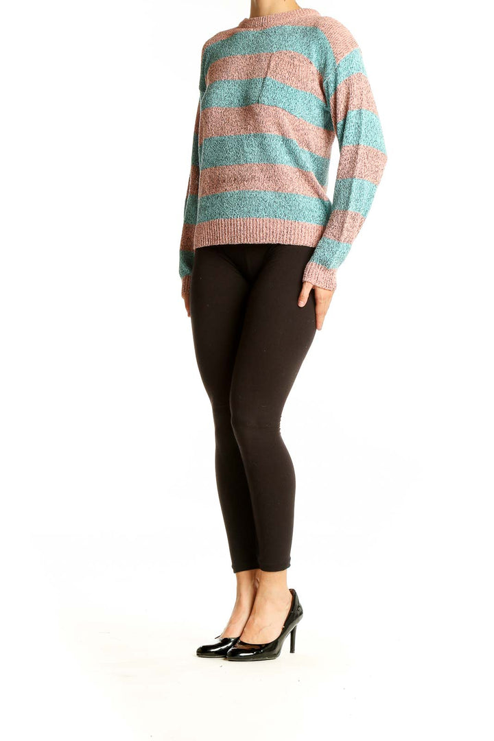 Front view of pink and teal striped knit sweater from Collections