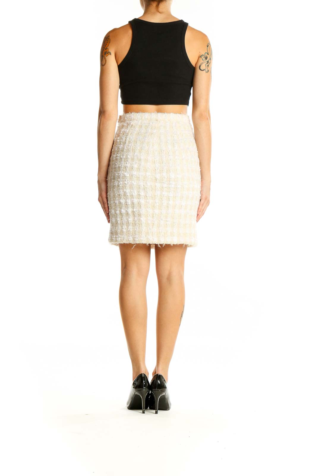 Side view of ESCADA cream textured pencil skirt paired with black top