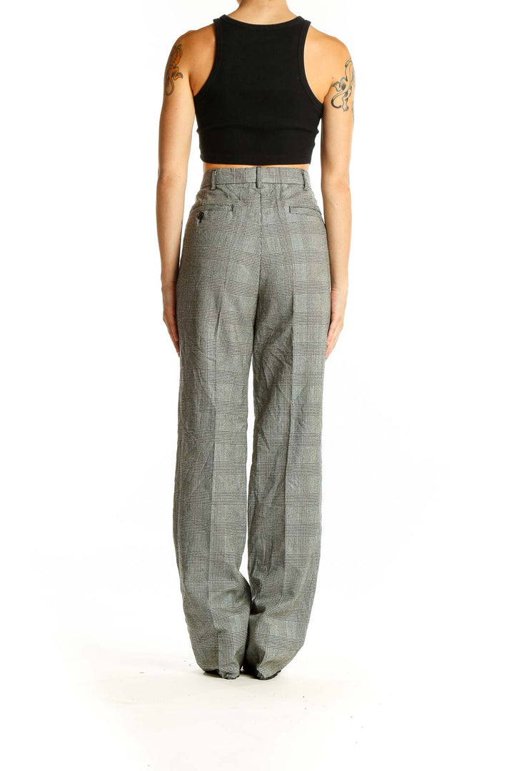 Back view of SilkRoll gray plaid wide-leg trousers on model with black crop top