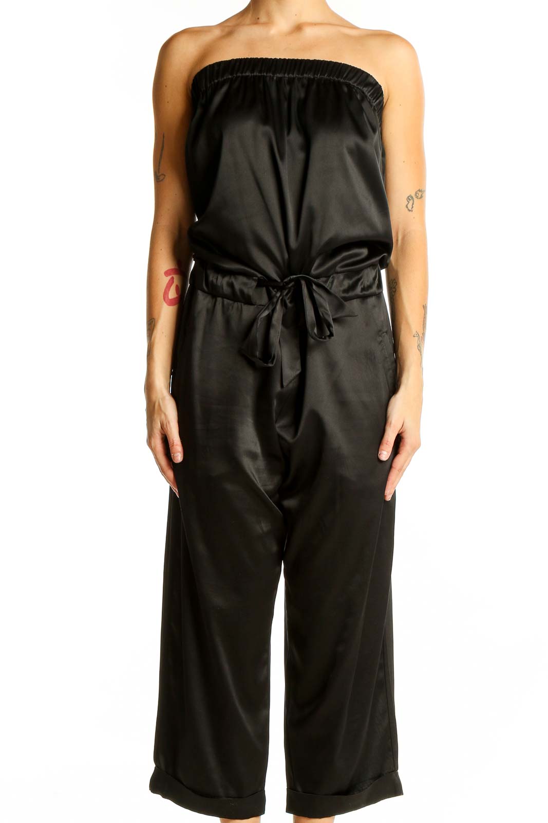 Front view of black strapless satin jumpsuit with tie waist